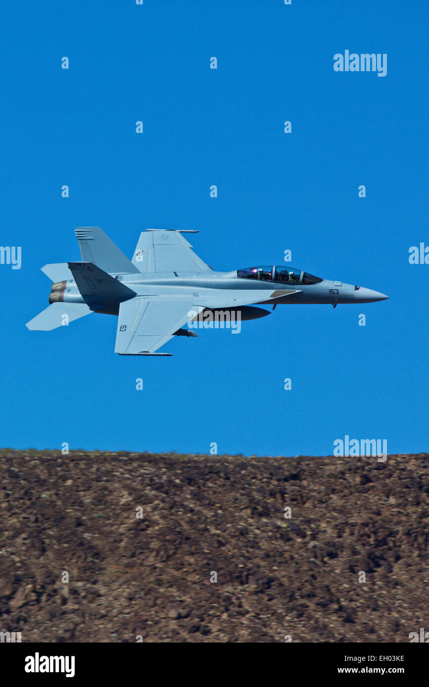 Close Up Topside View Of A US Navy F/A-18F Super Hornet Jet Fighter Following The Jedi Transition In Rainbow Canyon, California Stock Photo