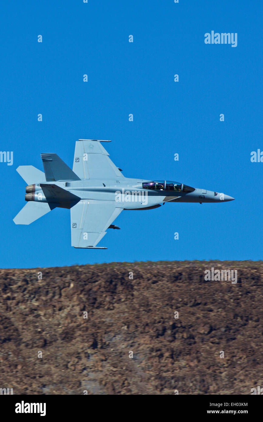 Close Up Topside View Of A US Navy F/A-18F Super Hornet Jet Fighter Following The Jedi Transition In Rainbow Canyon. Stock Photo