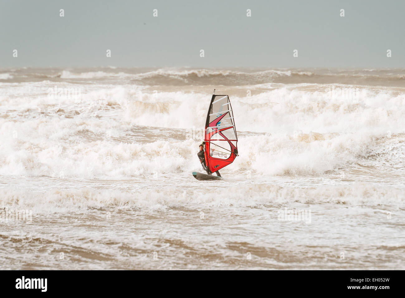 Windsurfers in choppy waters (Atlantic Ocean) on Bideford / Barnstaple Bay, Westward Ho!, North Devon, United Kingdom Stock Photo