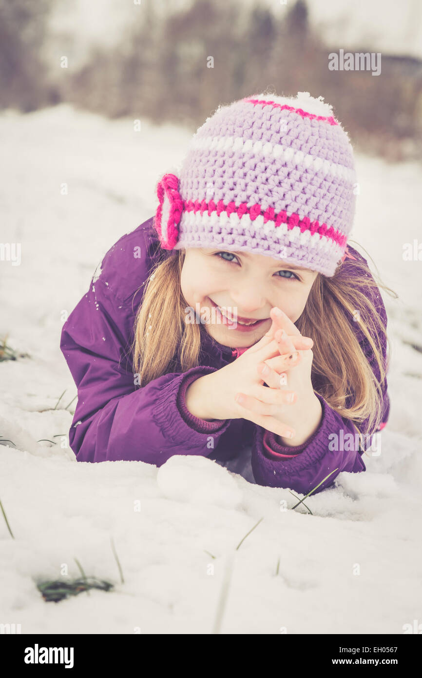 Portrait of smiling little girl in winter Stock Photo - Alamy