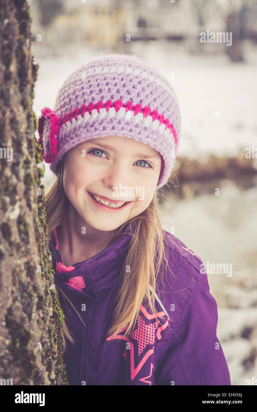 Portrait of smiling little girl in winter Stock Photo - Alamy