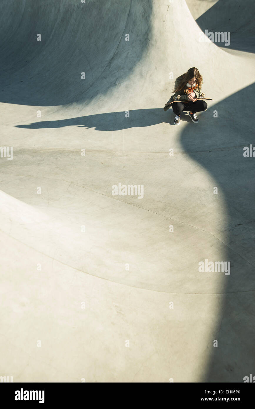 Lonely teenage girl in skatepark Stock Photo