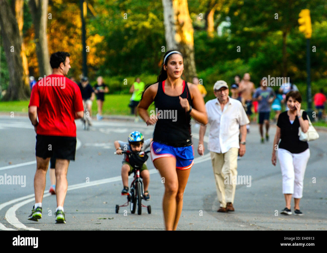 Runners in Central Park, Manhattan, New York City, USA. Practice run during afternoon summer. Stock Photo