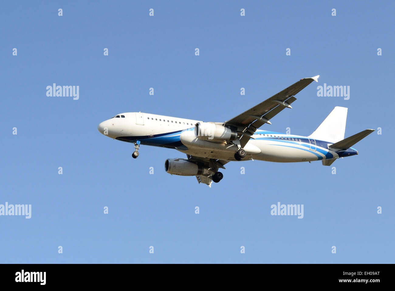 Blue airplane on the sky from bottom side view Stock Photo - Alamy