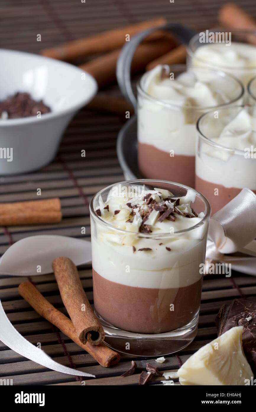 Mousse Au Chocolat In Glasses And Cinnamon Sticks Stock Photo