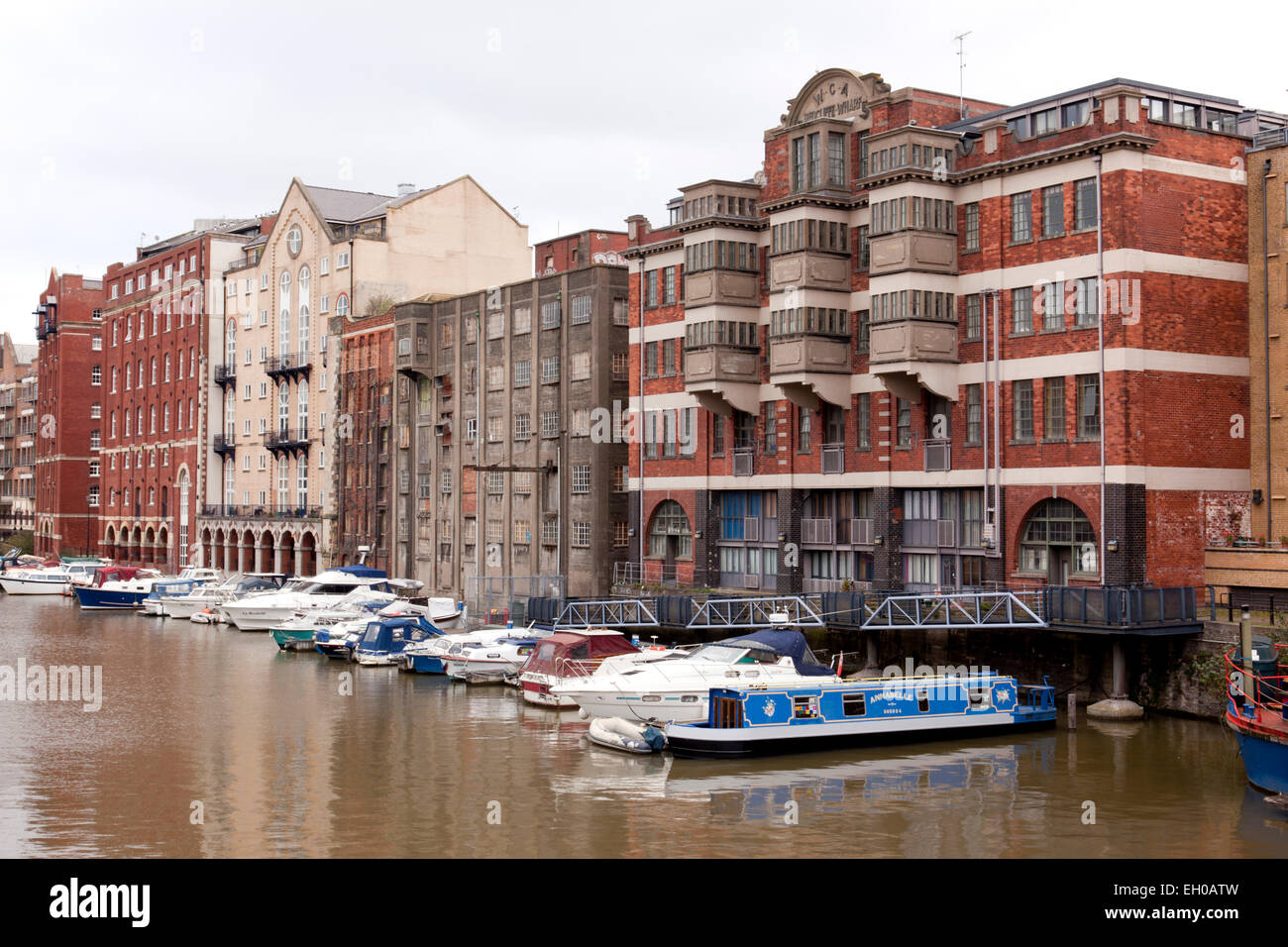 Old warehouses and apartments with boats moored alongside, Redcliffe Wharf,  Bristol harbourside, City of Bristol, England, UK Stock Photo