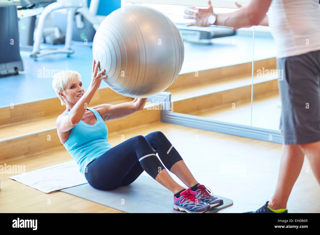 Woman with gymnastics ball in the gym Stock Photo Alamy