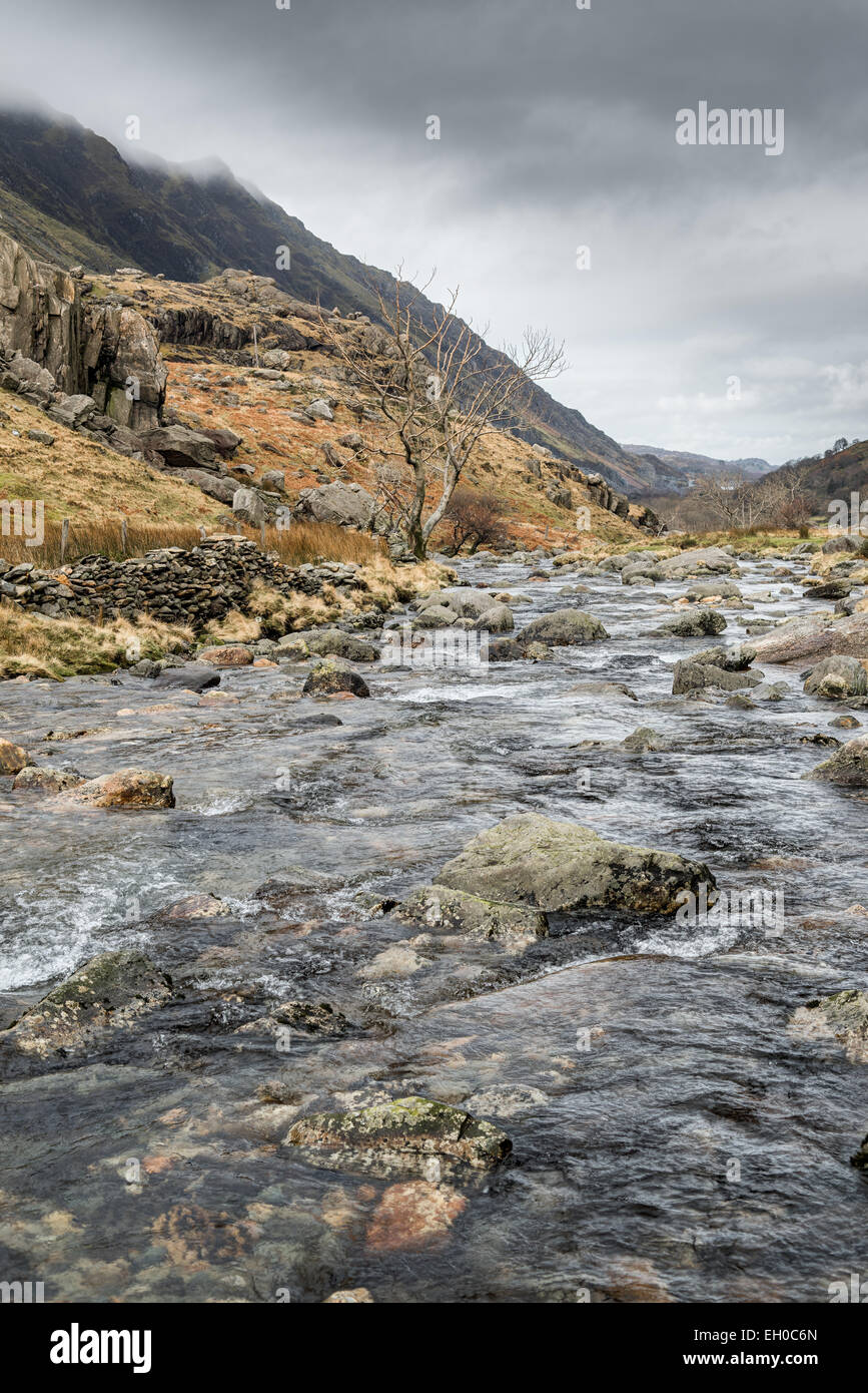 The mountain stream named nant Peris as it flows down the Llanberis pass from mount Snowdon to the village of Llanberis, Wales. Stock Photo