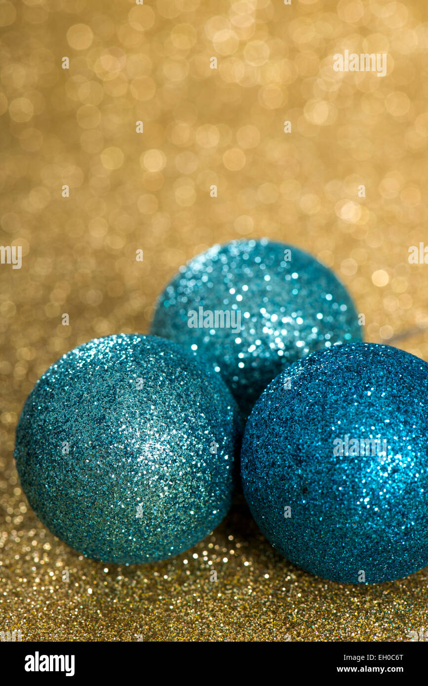 blue christmas balls on golden background Stock Photo - Alamy