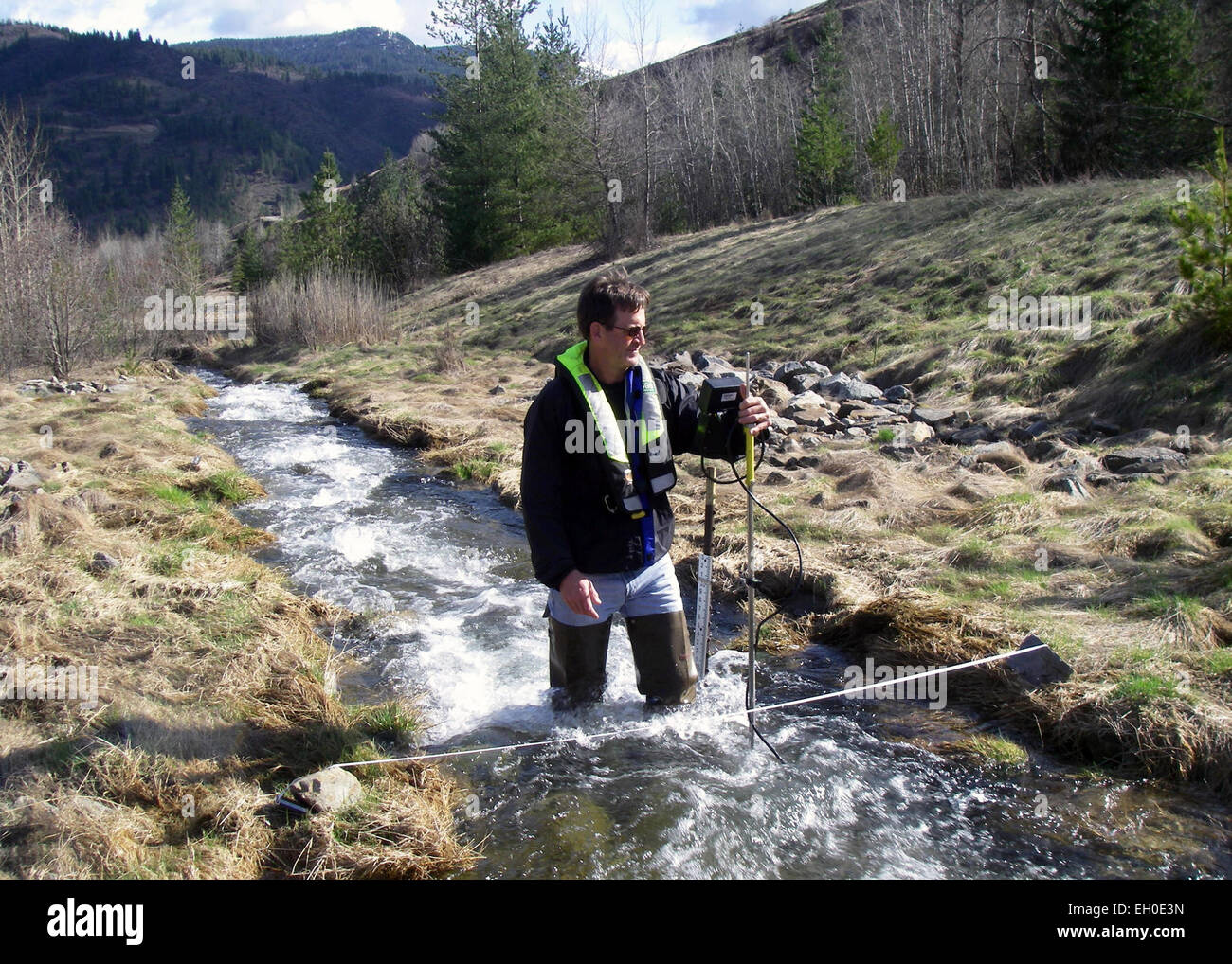 Hydrologist Measuring Streamflow Stock Photo