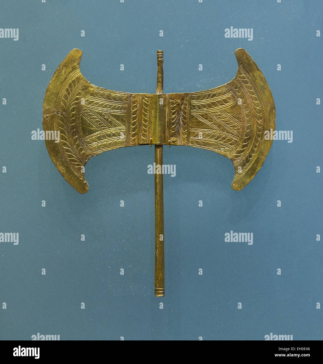 A small golden double head minoan axe. Votive jewel. Found in Archalokori cave, 1700 - 1450 BCE. Stock Photo
