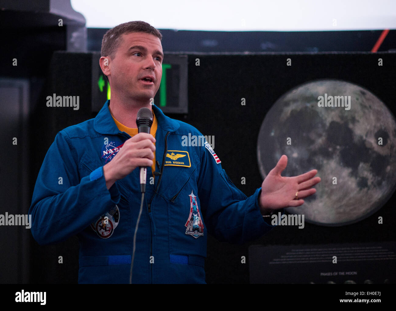 NASA Astronaut Reid Wiseman explains what it was like to live on the International Space Station for 6 months to visitors at the Maryland Science Center in his hometown Baltimore, Md. on Wednesday, February 11, 2015. Wiseman served on Expeditions 40 and 41 with Maxim Suraev of the Russian Federal Space Agency (Roscosmos) and Alexander Gerst  of ESA (European Space Agency), and returned home in November 2014. Stock Photo