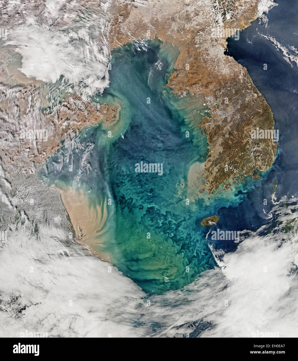 Remote sensing of ocean color in the Yellow Sea can be a challenge. Phytoplankton, suspended sediments, and dissolved organic matter color the water while various types of aerosols modify those colors before they are &quot;seen&quot; by orbiting radiometers.  The Aqua-MODIS data used to create the above image were collected on February 24, 2015.  NASA's OceanColor Web is supported by the Ocean Biology Processing Group (OBPG) at NASA's Goddard Space Flight Center. Our responsibilities include the collection, processing, calibration, validation, archive and distribution of ocean-related products Stock Photo