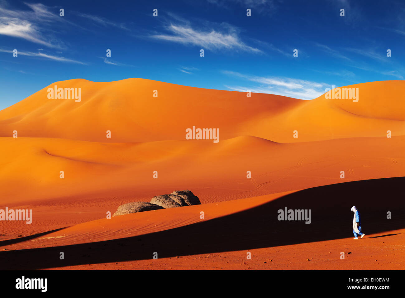 Tuareg in desert at sunset, Sahara Desert, Algeria Stock Photo
