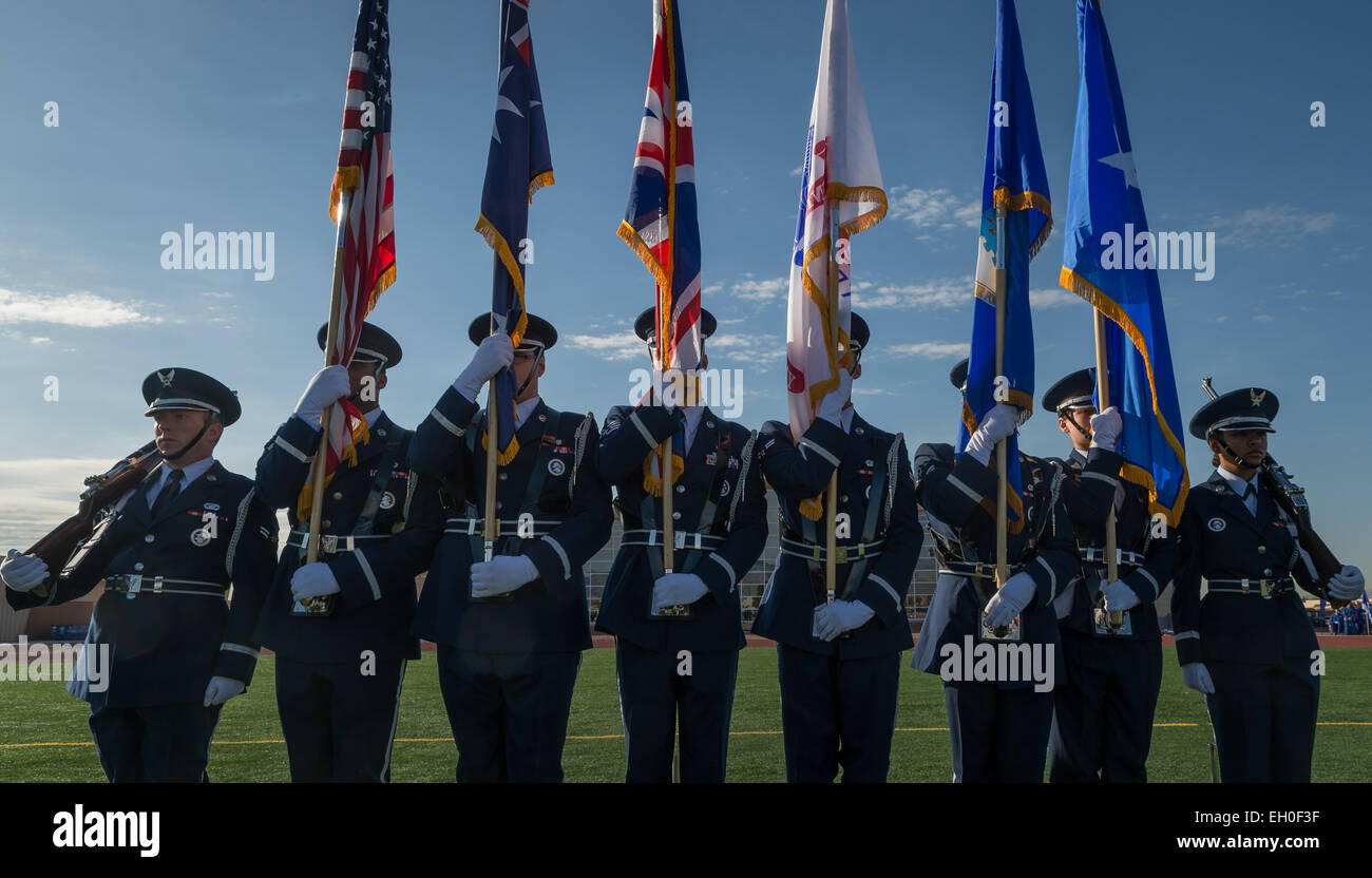 The Nellis Air Force Base honor guard posts the American, Australian and United Kingdom colors during the opening ceremony of the Air Force Wounded Warrior (AFW2) Trials 2015 on Nellis Air Force Base, NV, February 27. The AFW2 Trials are an adaptive sports event designed to promote the mental and physical well-being of seriously ill and injured military members and veterans. More than 105 wounded, ill or injured service men and women from around the country will compete for a spot on the 2015 U.S. Air Force Wounded Warrior Team which will represent the Air Force at the 2015 Warrior Games held Stock Photo