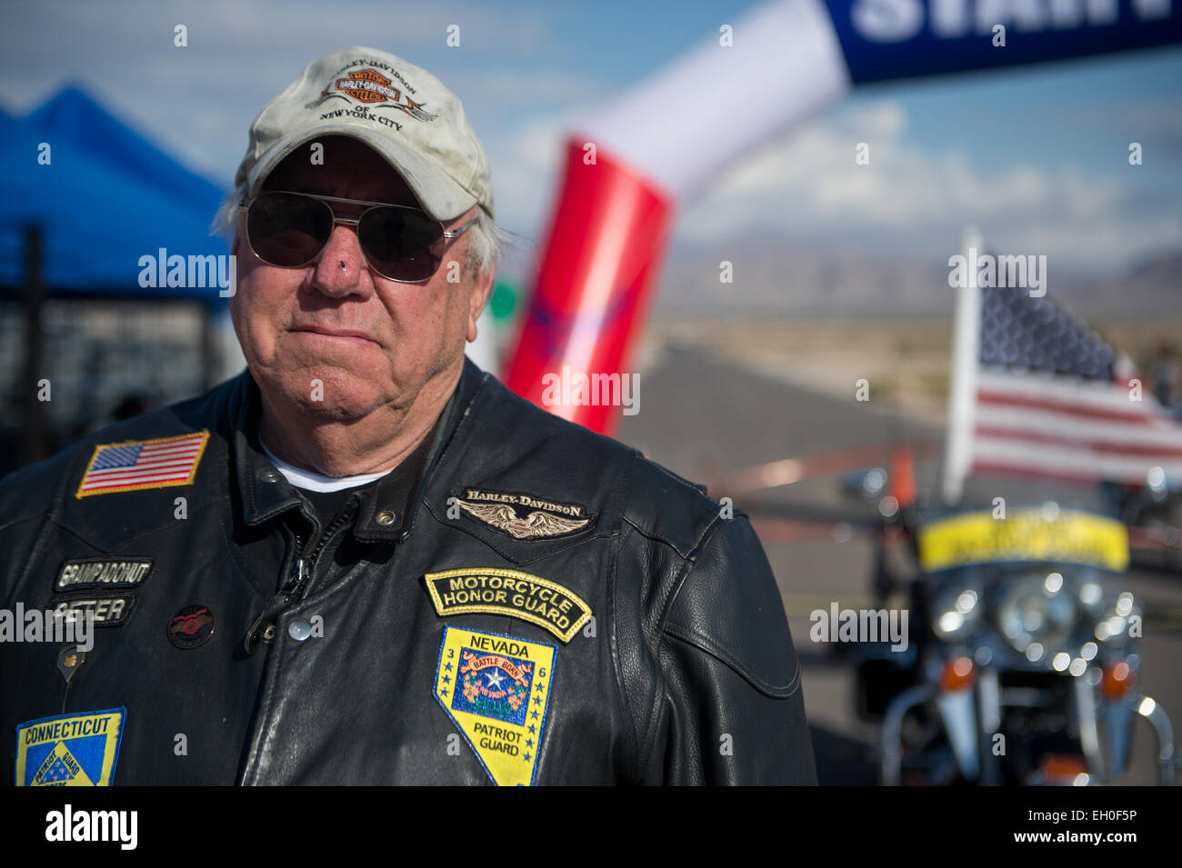 Peter Doyle, member of the Nevada Patriot Guard, awaits the start of the Air Force Wounded Warrior Trials cycling competition held at Nellis Air Force Base, Nev. Feb. 28, 2015. The Nevada Patriot Guard escorted the participants of the cycling competition around the track. The Air Force Trials are an adaptive sports event designed to promote the mental and physical well-being of seriously ill and injured military members and veterans. More than 105 wounded, ill or injured service men and women from around the country will compete for a spot on the 2015 U.S. Air Force Wounded Warrior Team which Stock Photo