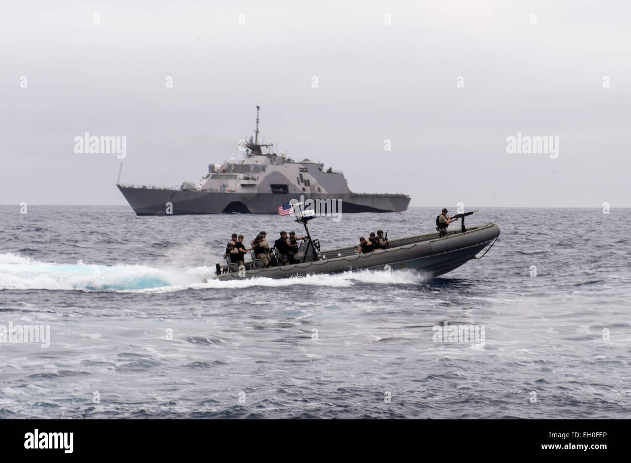 PACIFIC OCEAN (Feb. 16, 2015) Sailors assigned to Surface Warfare Detachment Four of the littoral combat ship USS Fort Worth (LCS 3) Crew 102 prepare to board a naval training vessel as part of visit, board, search and seizure (VBSS) training during an Independent Deployer Certification Exercise (IDCERTEX). IDCERTEX, led by Commander, U.S. 3rd Fleet (C3F) and executed by Commander, Carrier Strike Group (CSG) 15, is being conducted Feb. 9-20 off the Coast of Southern California and Hawaii. Stock Photo