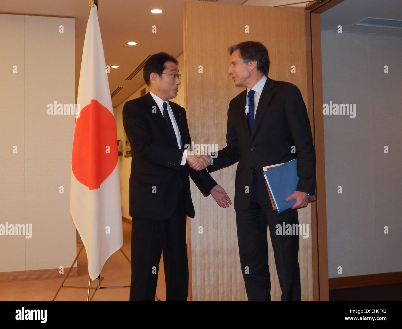 Deputy Secretary of State Antony &quot;Tony&quot; Blinken, right, is greeted by Japanese Foreign Minister Fumio Kishida prior to a meeting at the Ministry of Foreign Affairs in Tokyo, Japan, on February 13, 2014. Stock Photo
