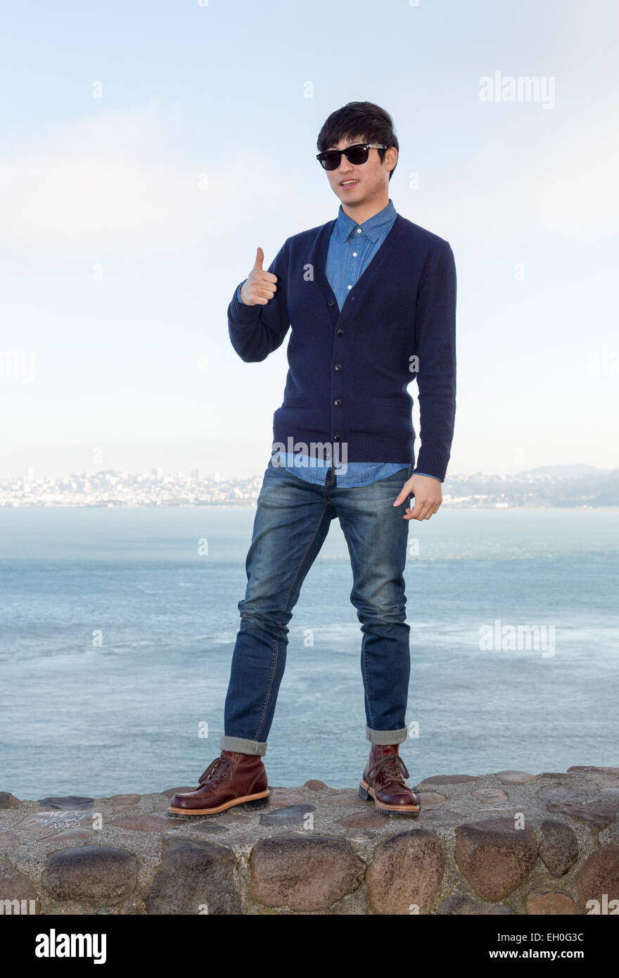 1, one, Asian man, posing for photograph, tourist, visitor, visiting, north side of Golden Gate Bridge, Vista Point, city of Sausalito, California Stock Photo