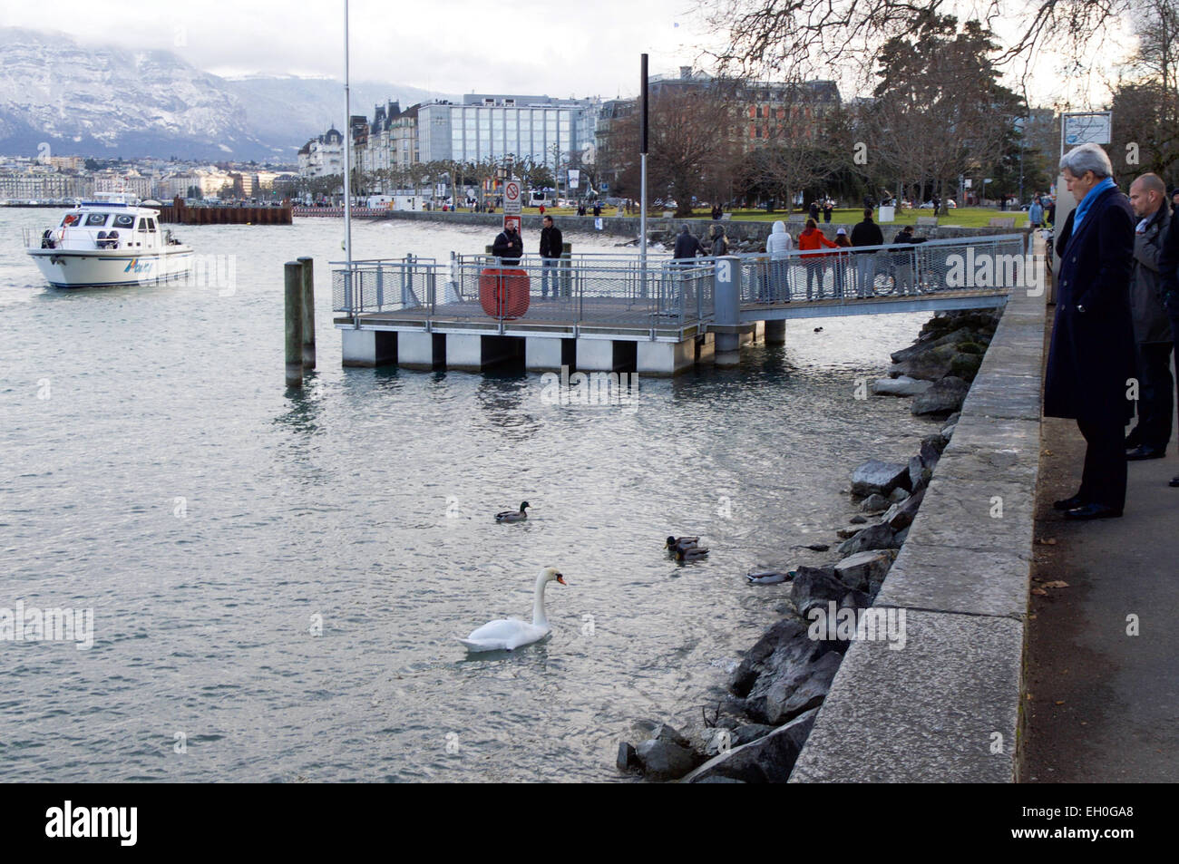 U.S. Secretary of State John Kerry admires a swan in Lake Geneva in Geneva, Switzerland, on February 22, 2015, while taking a walk before a round of talks with Iranian officials about the future of their nuclear program. Stock Photo