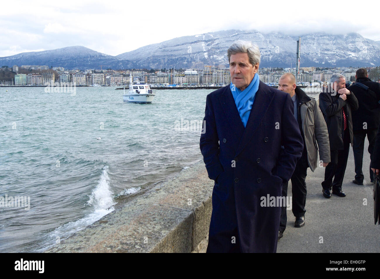 U.S. Secretary of State John Kerry takes a walk along Lake Geneva in Geneva, Switzerland, on February 22, 2015, before a round of talks with Iranian officials about the future of their nuclear program. Stock Photo