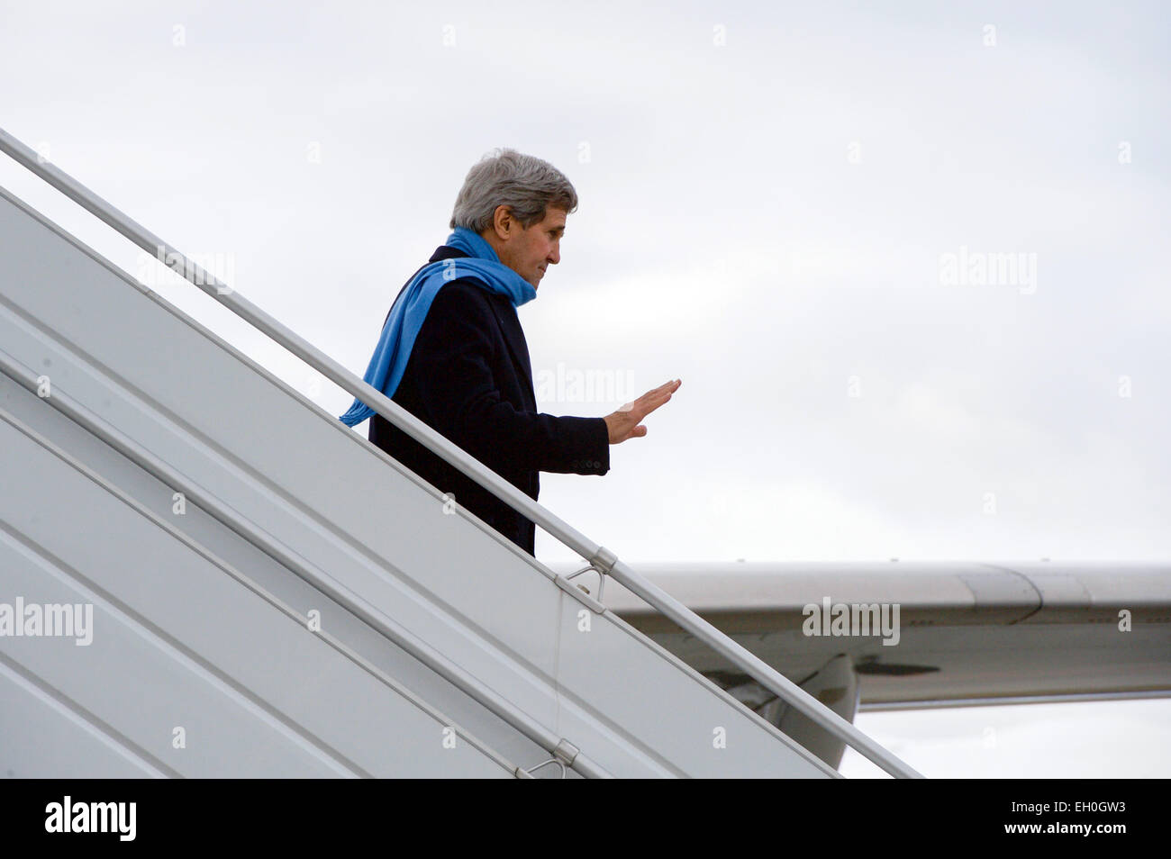 U.S. Secretary of State John Kerry waves to a group of greeters as he arrives in Geneva, Switzerland, on February 22, 2015, for a round of talks with Iranian officials about the future of their nuclear program. Stock Photo