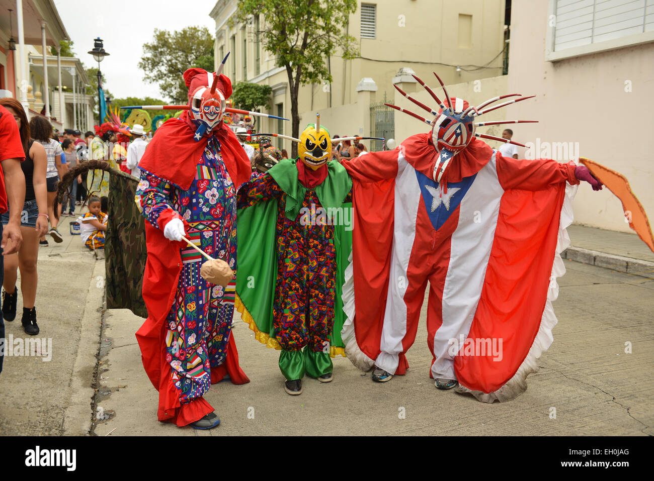 Three vejigantes posing during carnival in the streets of Ponce, Puerto Rico. February 2015 Stock Photo