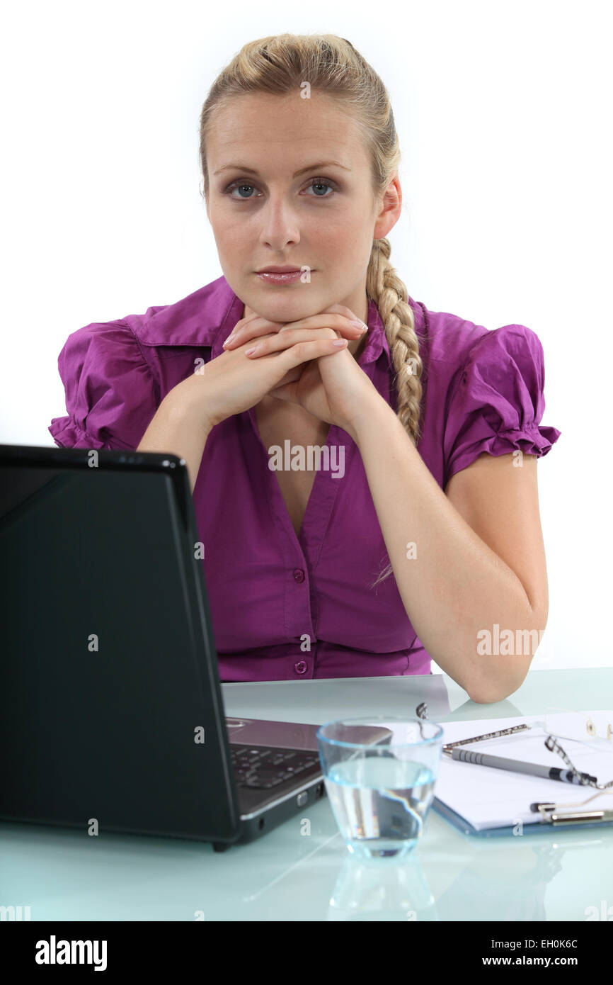 Woman working on her laptop Stock Photo