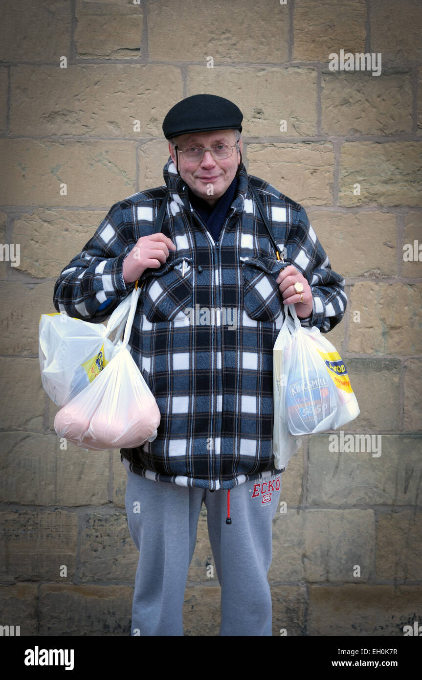 Man With Plastic Shopping Bags Stock Photo Alamy