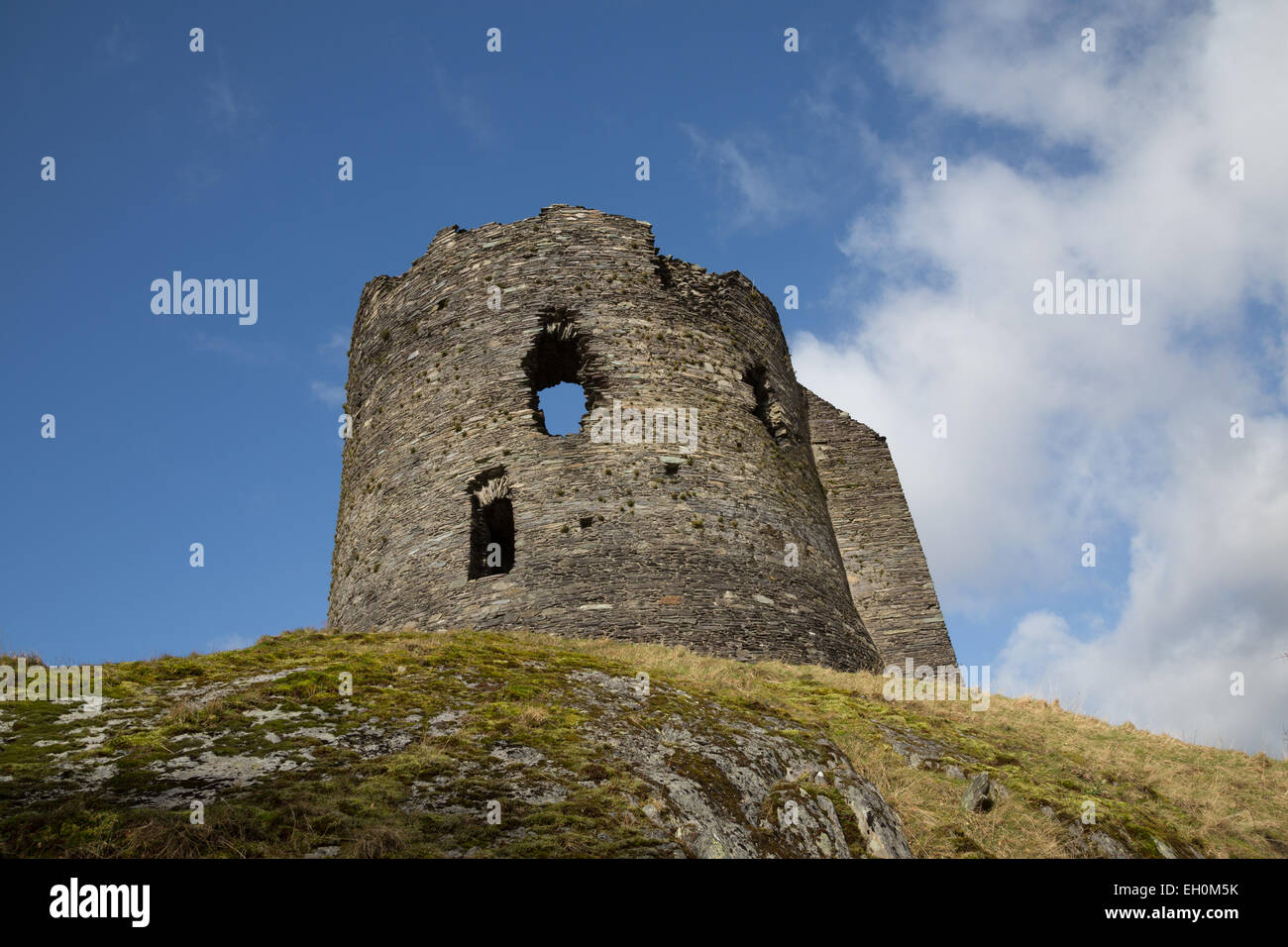 Looking up towards Dolbadarn Castle, Snowdonia, with a vivid blue winter sky beyond. Stock Photo