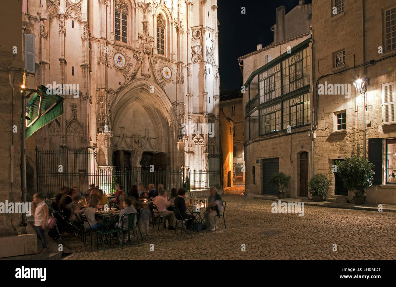 Diners at the gourmet restaurant L'Epicerie have a magnificent backdrop for their night out, the Church of St. Pierre.  Noted Stock Photo