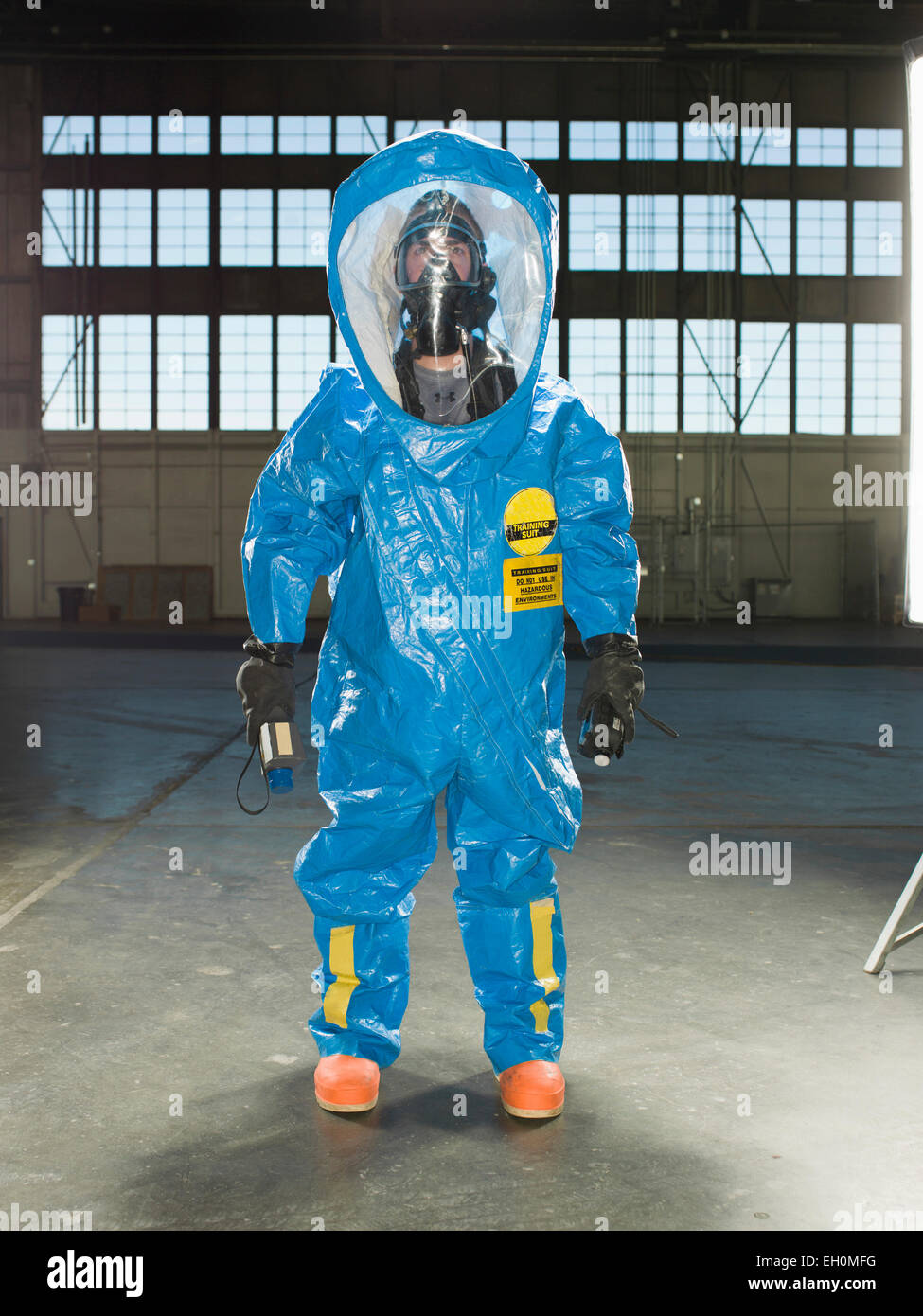 A National Guardsman wears a Nuclear radiation suit during training at an air base in South Dakota. Stock Photo