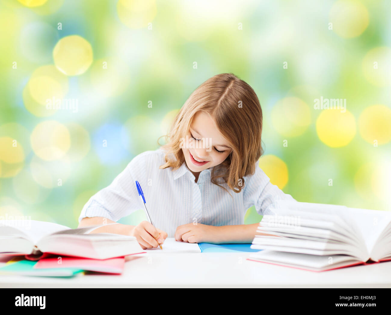 happy girl with books and notebook at school Stock Photo - Alamy