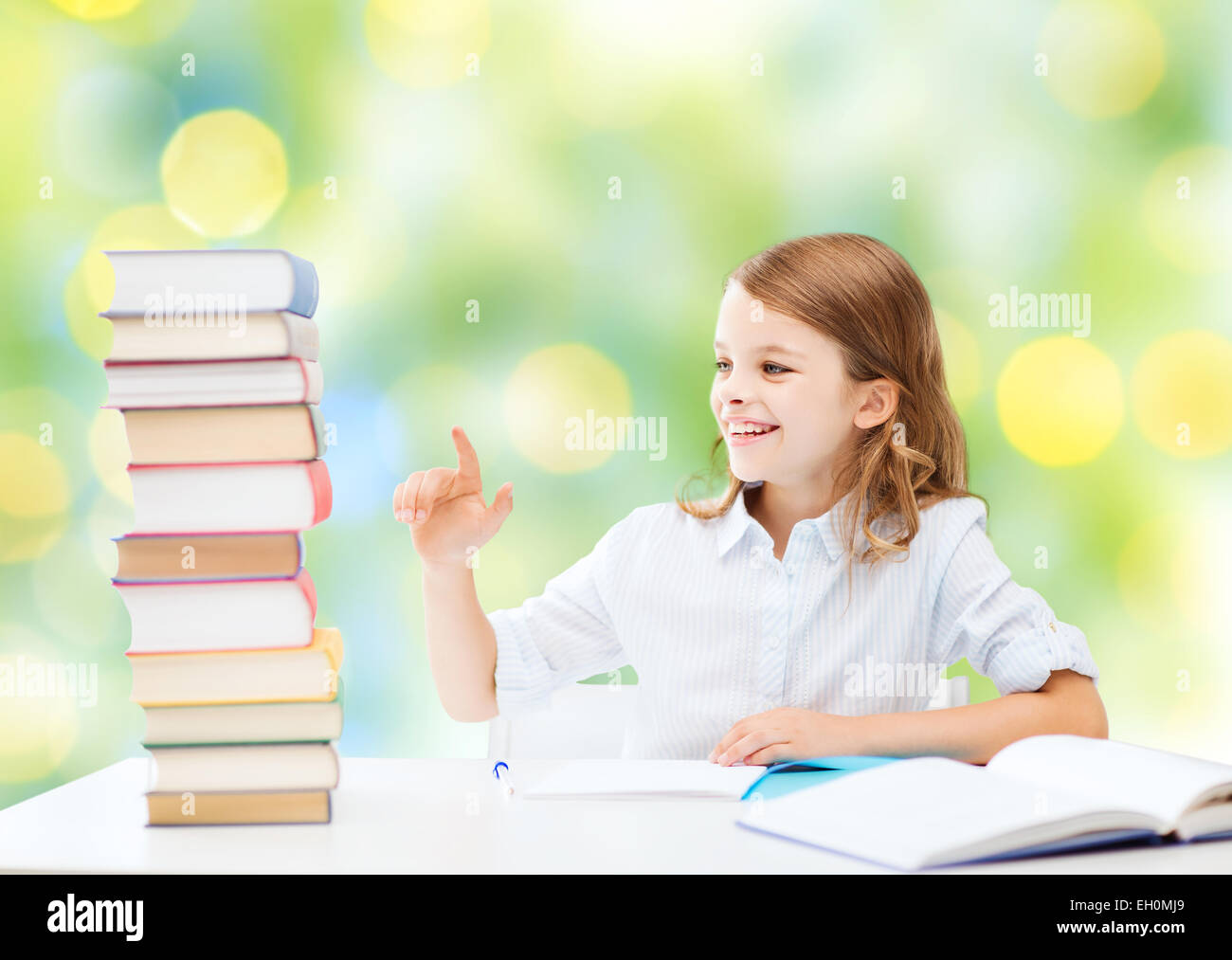happy girl with books and notebook at school Stock Photo - Alamy