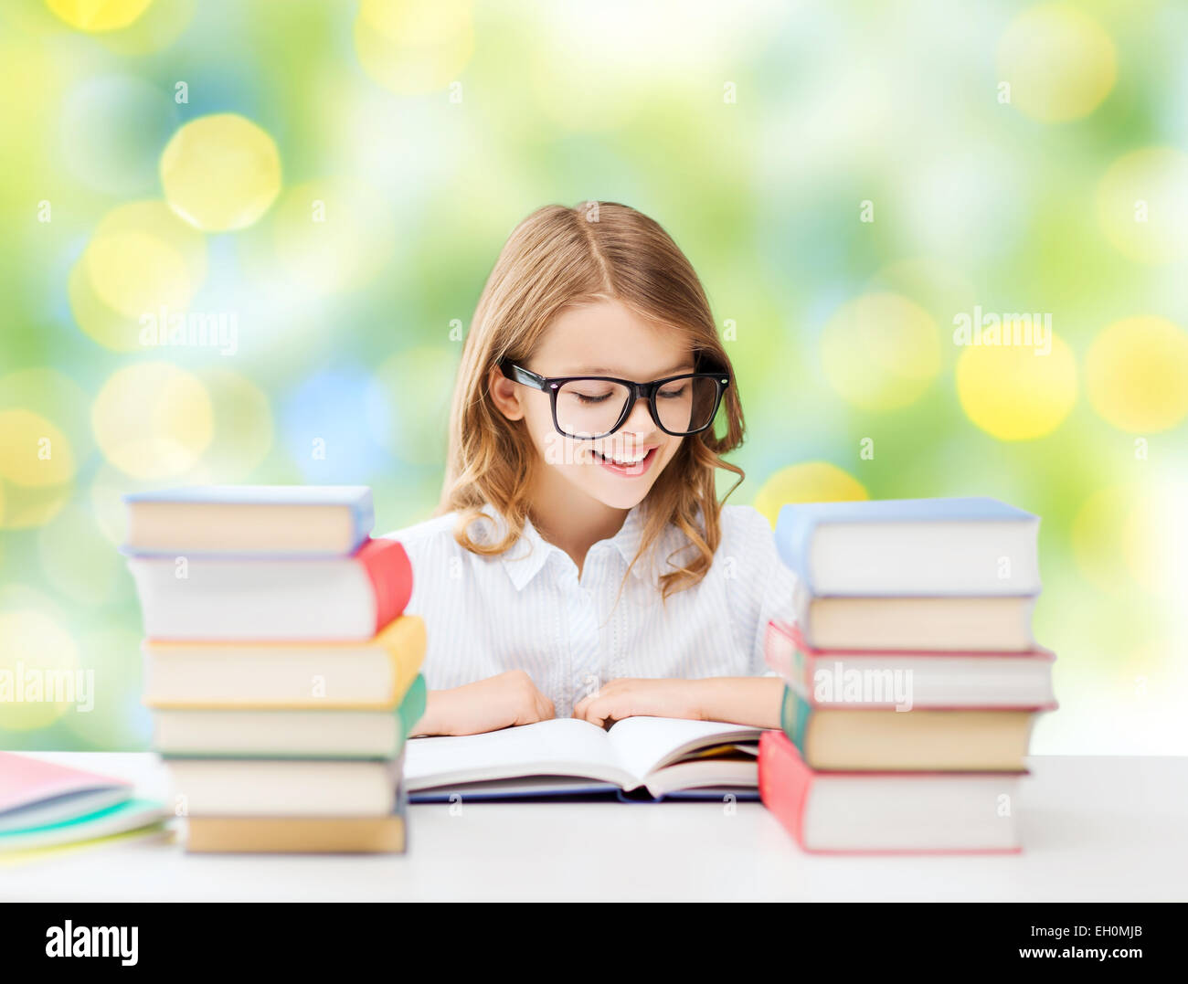 happy student girl reading book at school Stock Photo - Alamy