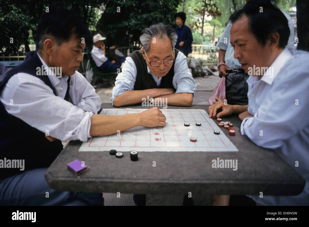 Group of men playing chinese chess, Beijing, China Stock Photo