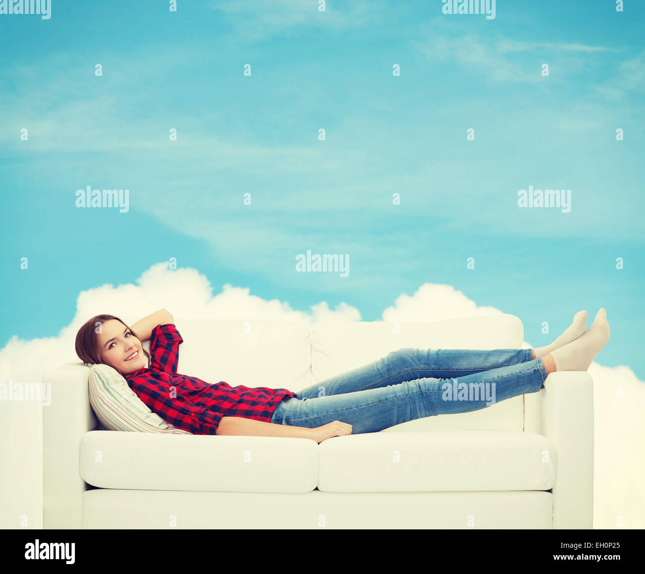 A young girl in underwear with a dreamy expression sitting on a furry  carpet leaning on a cozy sofa Stock Photo - Alamy