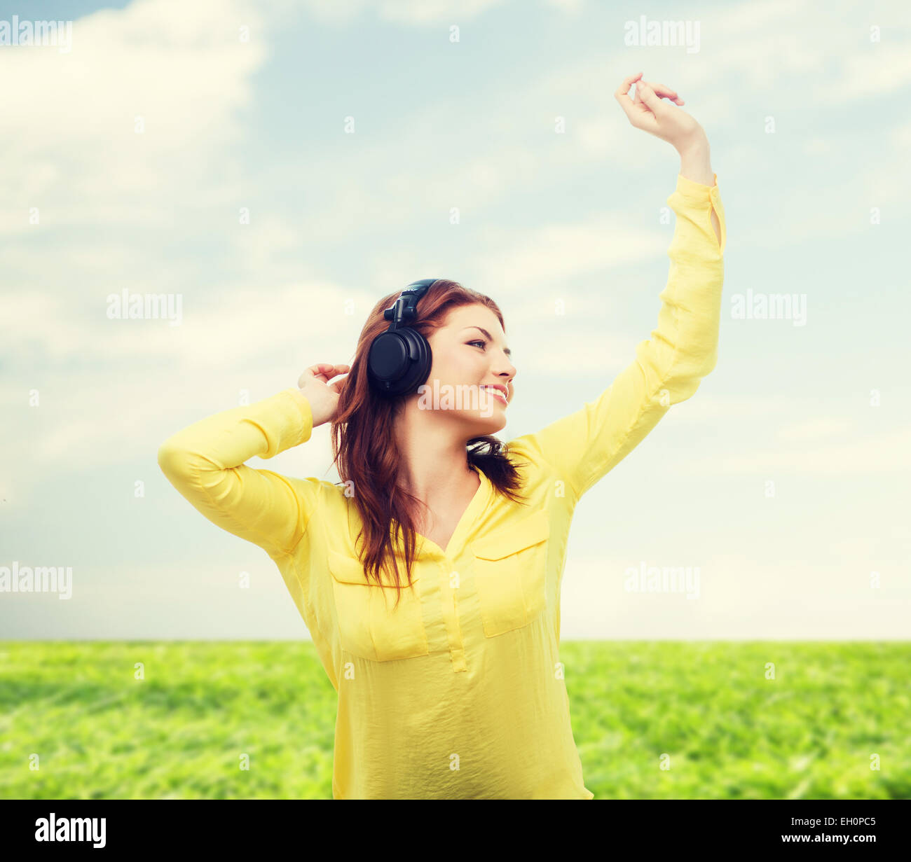 teenage girl sitting on sofa with headphones Stock Photo - Alamy