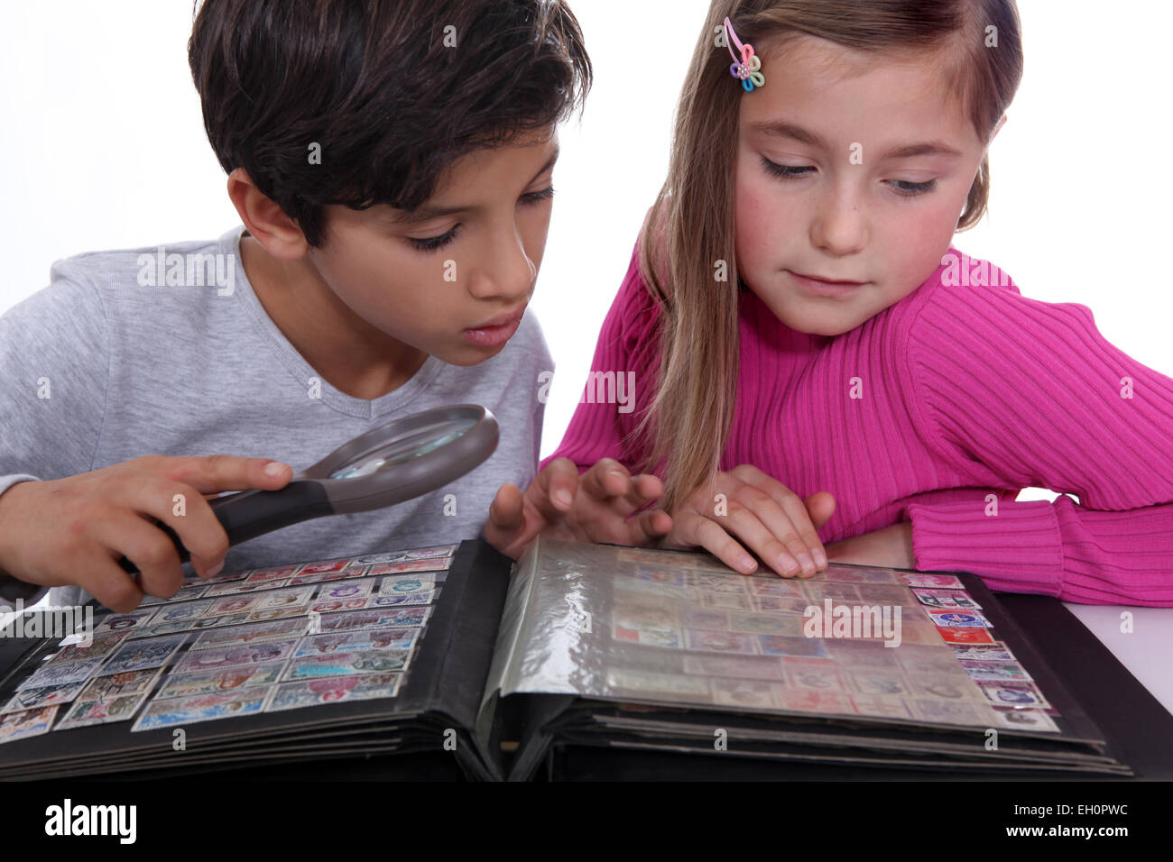Children collecting stamps Stock Photo Alamy