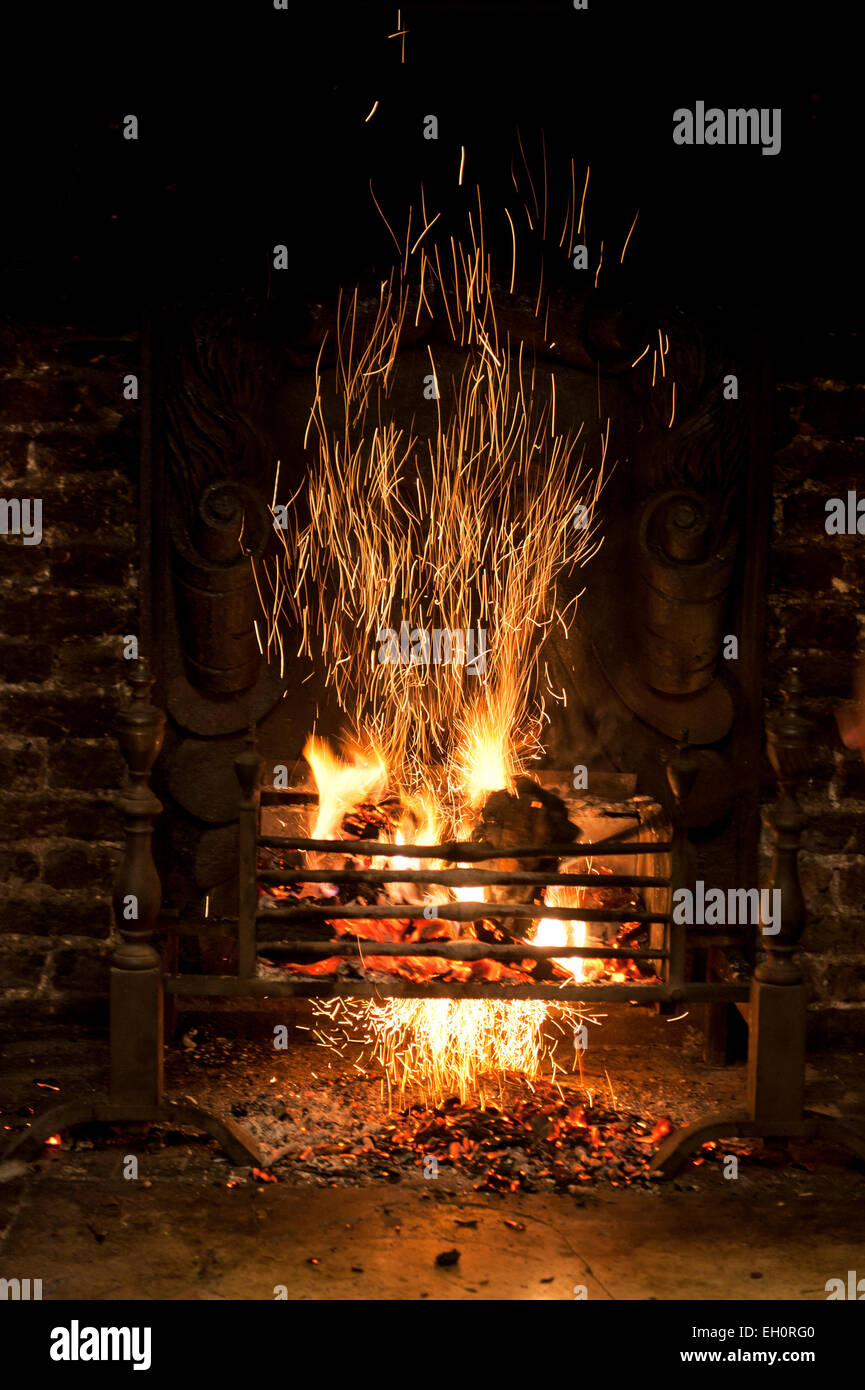 Fireplace with fire sparking Stock Photo