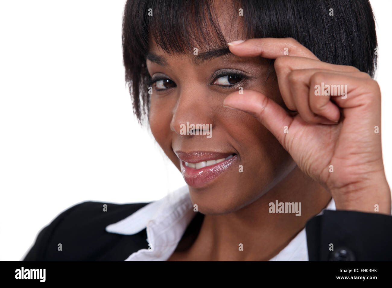 Portrait of a woman looking out of the corner of her eye Stock Photo