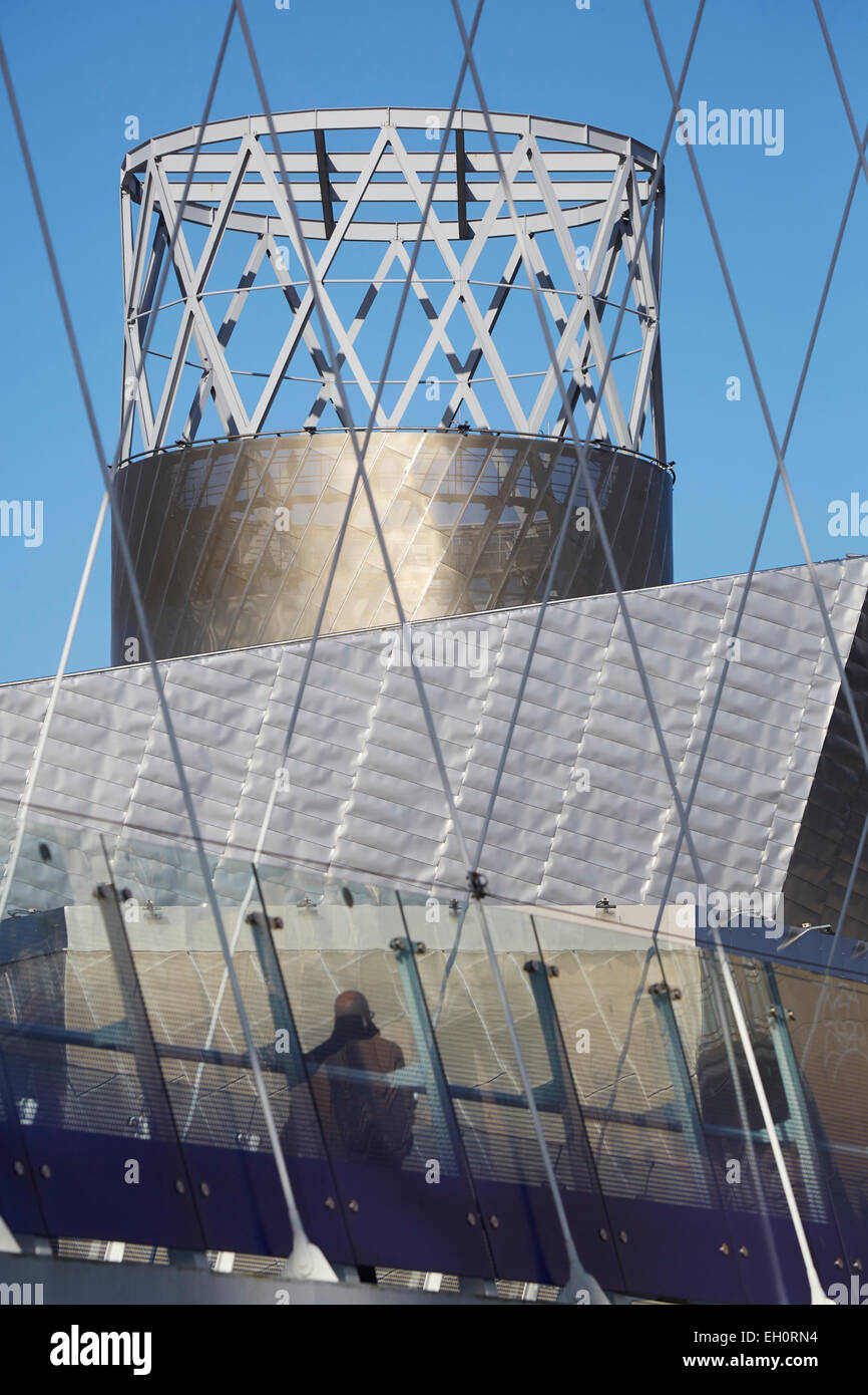 Lowry Outlet Mall at Media City Salford Quays Gtr Manchester UK. Lowry Theatre shot through the rods from the Millennium Bridge Stock Photo