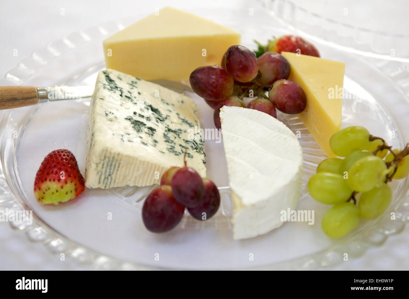 Selection of cheeses with grapes Stock Photo