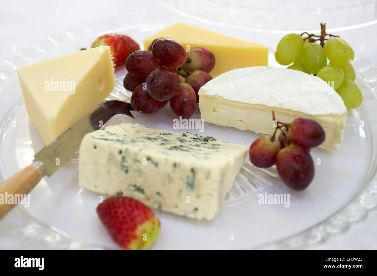 Selection of cheeses with grapes Stock Photo