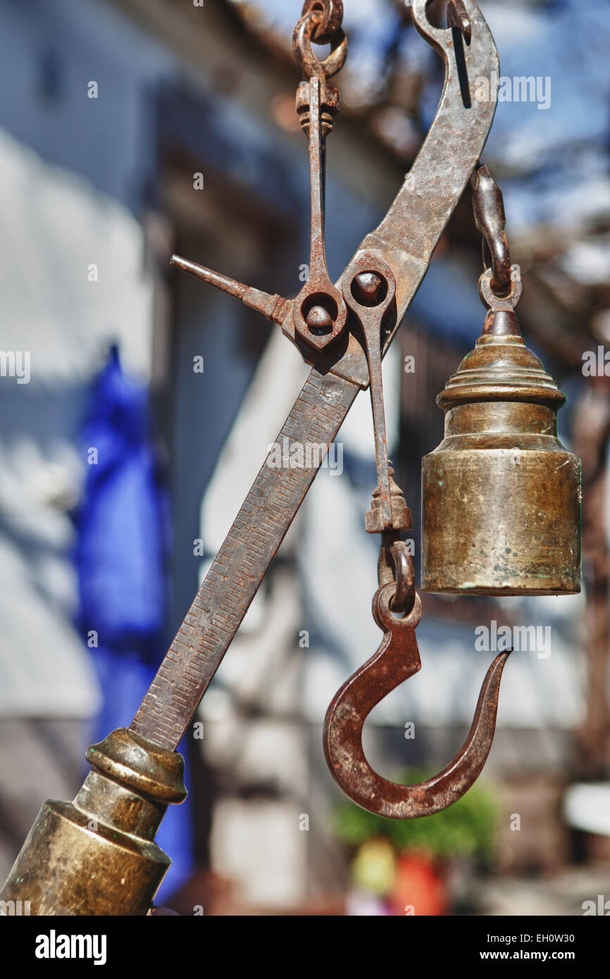 Hanging antique roman steelyard on a farm house, Badajoz, Spain Stock Photo