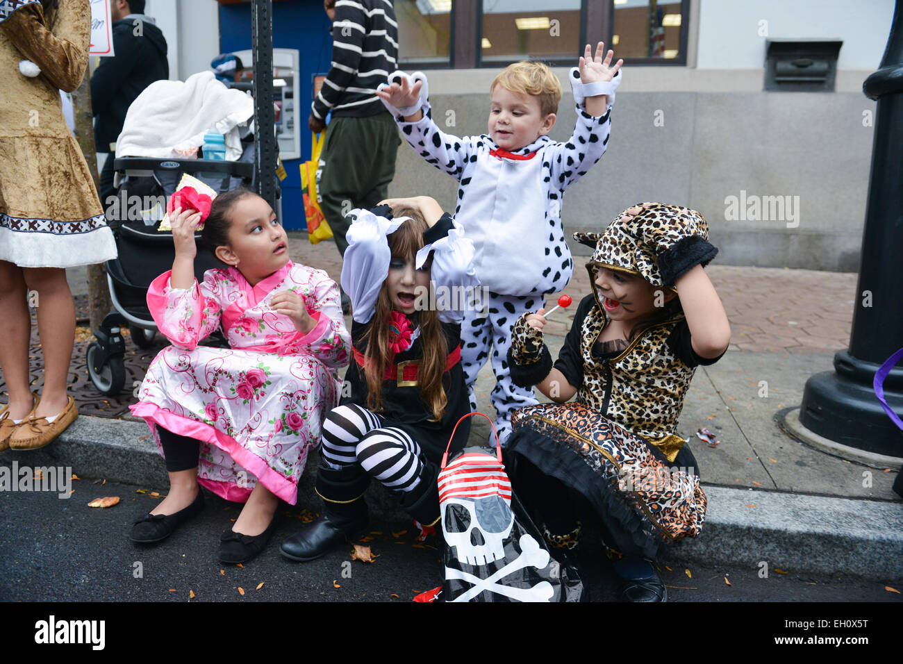 Group of kids enjoying some candy during Halloween in the streets of Newark, New Jersey USA. Stock Photo