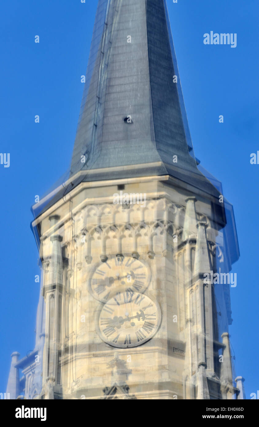 Saint Michael Church clock tower reflected in a shop window, Cluj-Napoca, Romania Stock Photo
