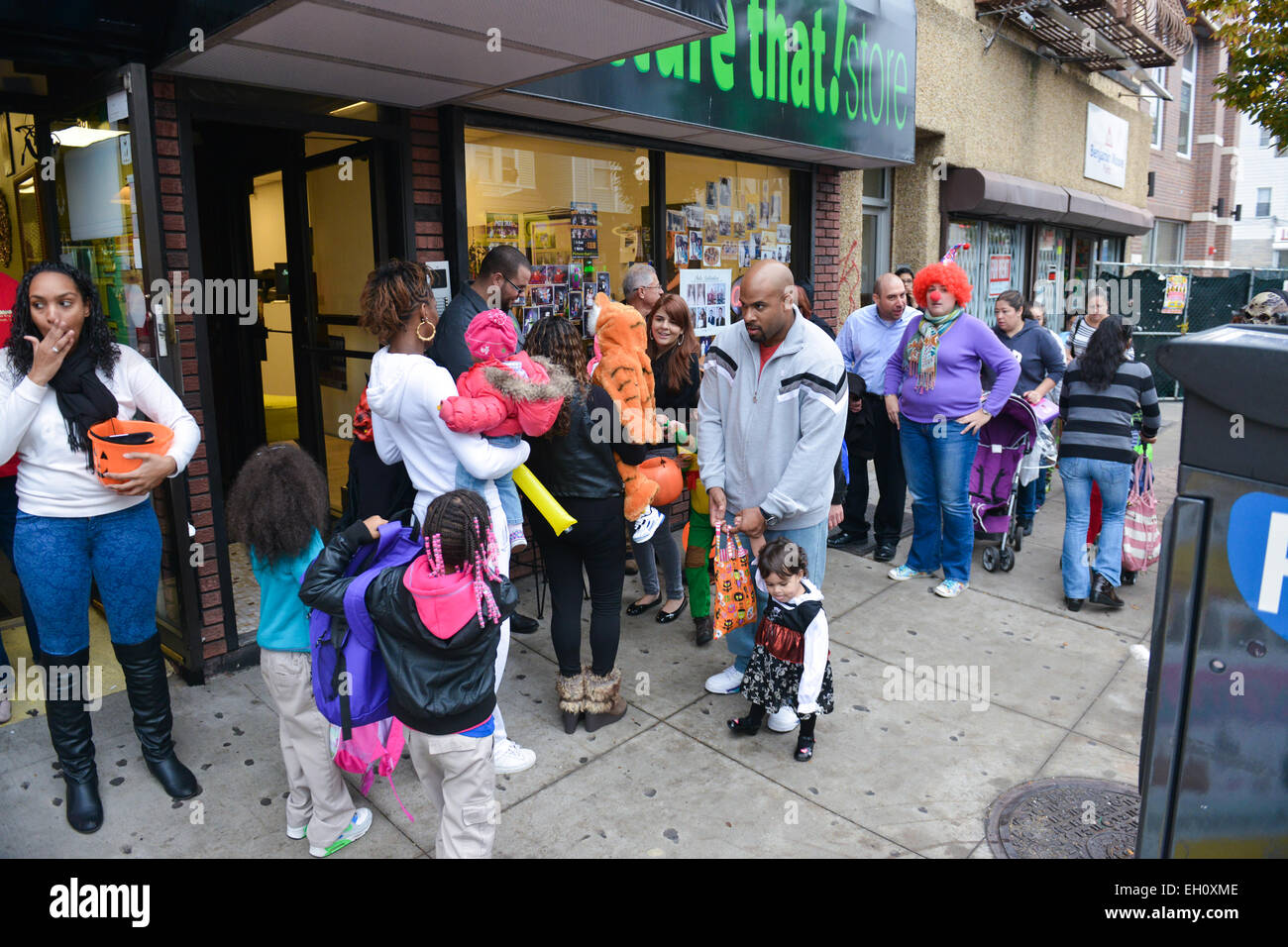 Group of people trick or treating on Ferry Street during Halloween