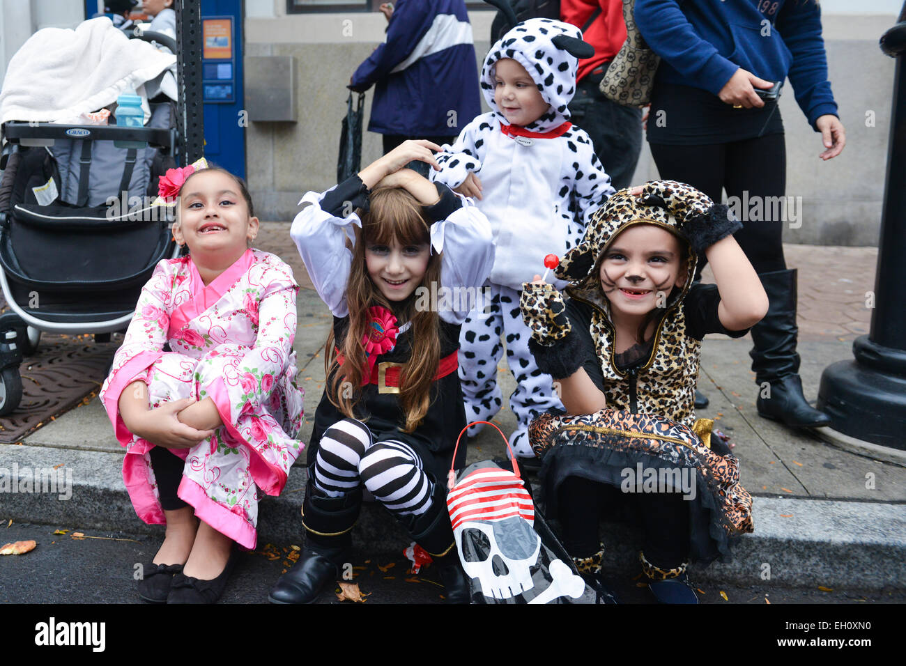 Group of kids enjoying some candy during Halloween in the streets of Newark, New Jersey USA. Stock Photo