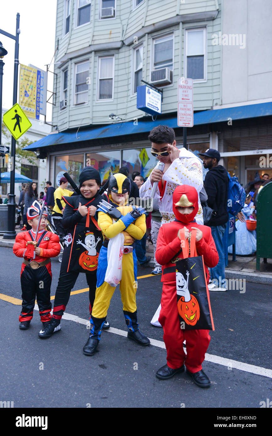 Group of kids dressed in costumes poses during Halloween in the streets of Newark, New Jersey USA. Stock Photo